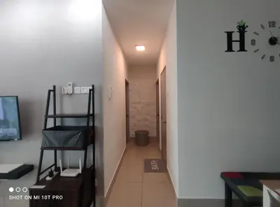 a hallway with a stairway leading to a room at HaNi Homestay KL in Kuala Lumpur