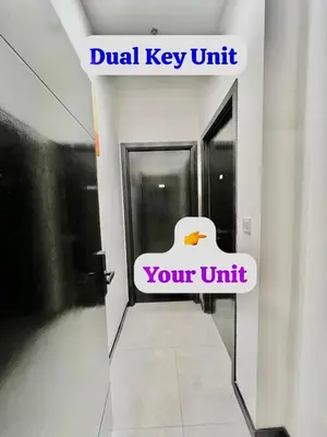 a sign that says dual key unit with a duck in a hallway at Couple Suite at Neu Suites near Gleneagles in Kuala Lumpur
