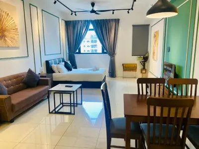 a living room with a couch and a table at Chambers Suites KLCC Serviced Apartment in Kuala Lumpur