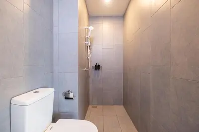 a bathroom with a toilet and a shower at M Vertica KL Residence Tower E by Feel Home in Kuala Lumpur