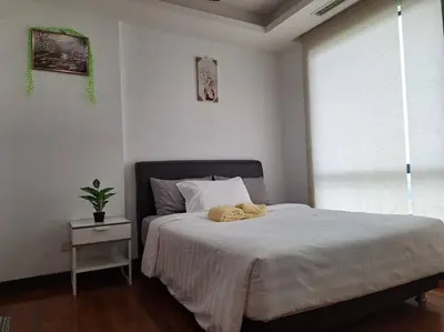 a bedroom with a bed with two towels on it at 021-6 Sweet Home-Casa Residency in Kuala Lumpur