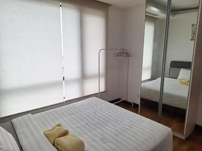 a bedroom with a mirror and a bed and a bed sidx sidx sidx at 021-6 Sweet Home-Casa Residency in Kuala Lumpur