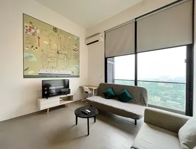 a living room with a couch and a tv at Nana'S at EST Bangsar KL Sentral Gem Loft in Kuala Lumpur