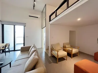 a living room with a couch and a table at Nana'S at EST Bangsar KL Sentral Gem Loft in Kuala Lumpur