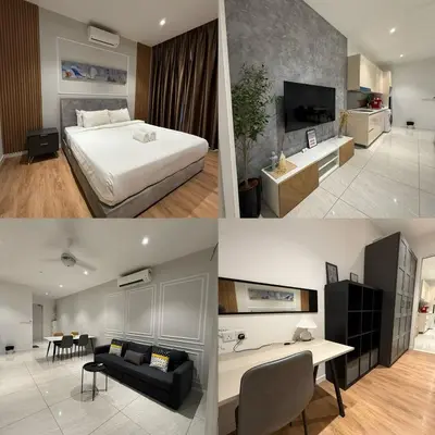 a hotel room with a bed and a living room at Quill Residences Suites KLCC By Dhome in Kuala Lumpur