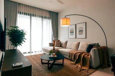 a living room with a couch and a table at ViiA Residence, Mid Valley KL in Kuala Lumpur