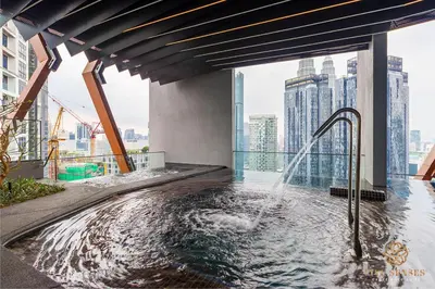 a hot tub on the floor of a skyscraper at Scarletz Signature Suites, KLCC in Kuala Lumpur