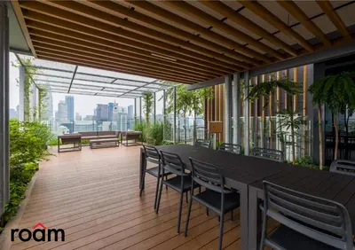 a balcony with a table and chairs on a building at Ceylonz Signature Suites, Bukit Bintang in Kuala Lumpur