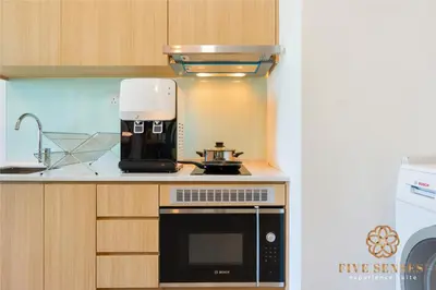 a kitchen with a coffeemaker on a counter at The Colony & The Luxe Signature Suites, KLCC in Kuala Lumpur