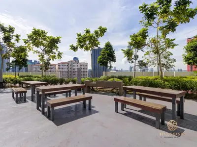 a group of picnic tables and benches in a park at Datum Jelatek Residence, KLCC in Kuala Lumpur