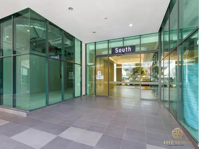 an empty lobby of a building with glass doors at Datum Jelatek Residence, KLCC in Kuala Lumpur