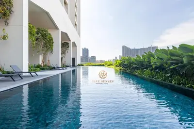 a swimming pool in the middle of a building at UNA Signature Suites, Sunway KL in Kuala Lumpur