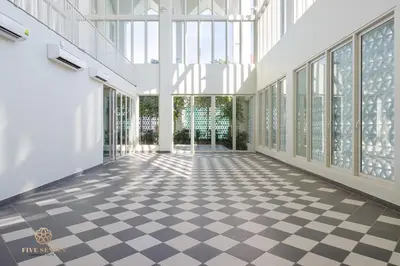 an empty room with a checkered floor in a building at UNA Signature Suites, Sunway KL in Kuala Lumpur