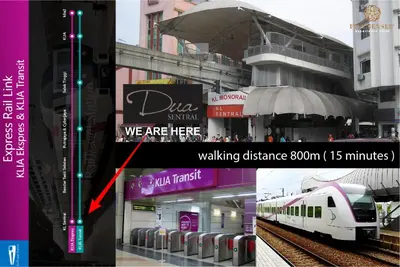 a train station with a train on the tracks at Dua Sentral Signature Suites in Kuala Lumpur
