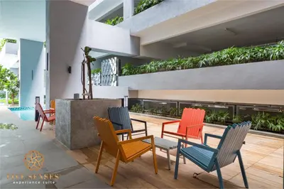 a group of chairs and tables in a building at Neu Suites Signature Suites, KLCC in Kuala Lumpur