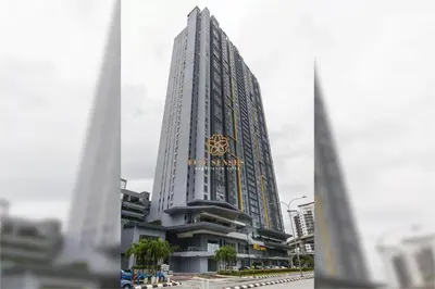 a tall building with a clock on the side of it at Neu Suites Signature Suites, KLCC in Kuala Lumpur