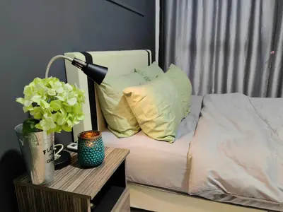 a bed with a lamp on a table next to it at Arte Mont Kiara MITEC Publika MATRADE kuala lumpur 1R2B 4 Pax in Kuala Lumpur