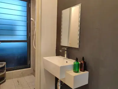 a bathroom with a white sink and a mirror at Arte Mont Kiara MITEC Publika MATRADE kuala lumpur 1R2B 4 Pax in Kuala Lumpur