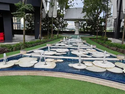 a group of rocks in a fountain on the grass at Arte Mont Kiara MITEC Publika MATRADE kuala lumpur 1R2B 4 Pax in Kuala Lumpur