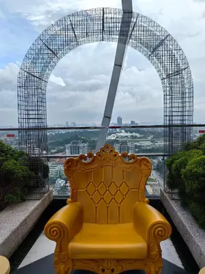 a yellow bench in front of a large window at Arte Mont Kiara MITEC Publika MATRADE kuala lumpur 1R2B 4 Pax in Kuala Lumpur