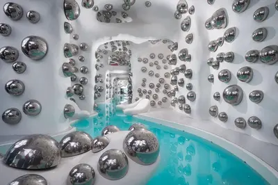 a bathroom with a bunch of silver balls on a wall at Arte Plus Ampang KLCC City in Kuala Lumpur