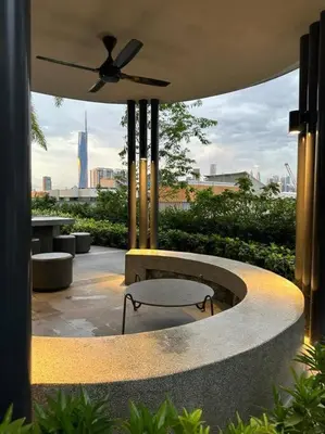 a patio with a table and a ceiling fan at Trion KL Family Condotel TRX KLCC MRT in Kuala Lumpur