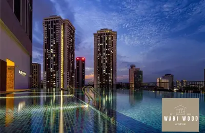 a view of a city skyline with tall buildings at Chambers Suites KL by Wabi Wood's House in Kuala Lumpur