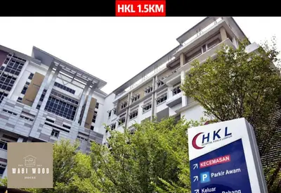 a building with a sign in front of it at Chambers Suites KL by Wabi Wood's House in Kuala Lumpur