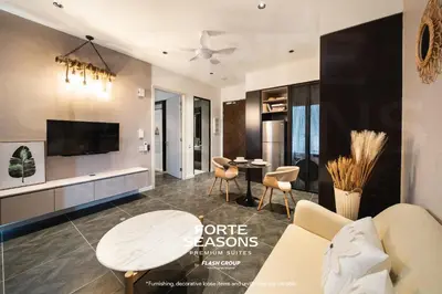a living room with a couch and a table at Forte Seasons Scarletz Premium Suites @ KLCC in Kuala Lumpur