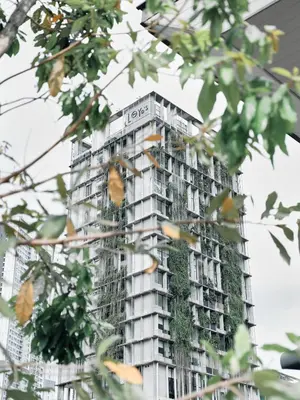 a building with a green ivy on it at Lloyd's Inn Kuala Lumpur in Kuala Lumpur