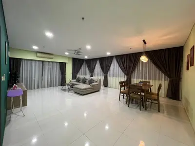 a living room with a couch and a table at Summer Suits Klcc by KL Residence in Kuala Lumpur