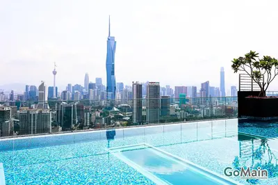 a swimming pool with a view of the city at Infinity SkyPool - KL Suite KL Sentral Brickfield by GoMain in Kuala Lumpur