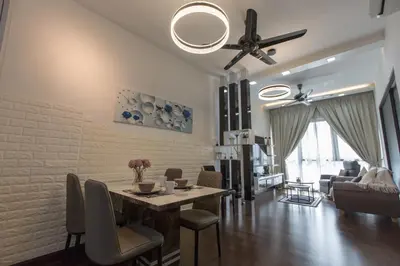 a living room with a dining room table and a ceiling fan at V Residence at Sunway Velocity by MY TRIP & MY STAY in Kuala Lumpur
