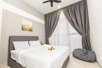 a bedroom with a large white bed and a window at Trion KL city centre near KLCC & TRX by MY TRIP & MY STAY in Kuala Lumpur