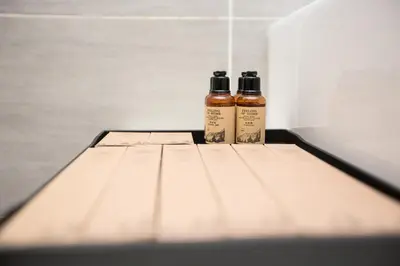 two bottles of essential oils sitting on a shelf at Trion KL city centre near KLCC & TRX by MY TRIP & MY STAY in Kuala Lumpur