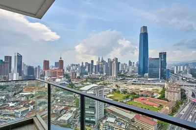 a view of a city from the balcony of a skyscraper at Continew Residence TRX KL in Kuala Lumpur