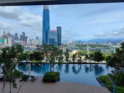 a view of a city skyline with a pool of water at Continew Residence TRX KL in Kuala Lumpur