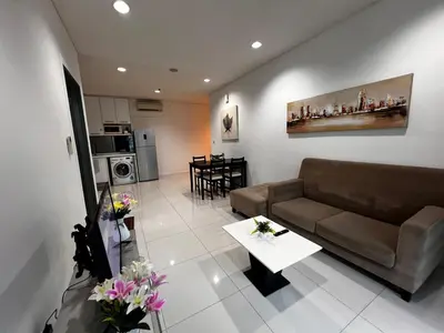 a living room with a couch and a table at Mercu summer Suites by KL Residence in Kuala Lumpur