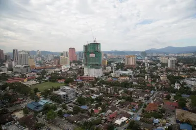 an overhead view of a city with a tall building at PLATINUM Suites KLCC By AR Hospitality in Kuala Lumpur