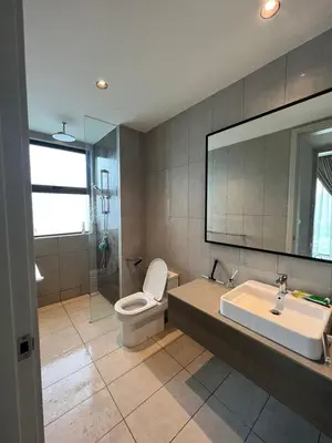 a bathroom with a toilet and a sink and a mirror at Datum Jelatek - KLCC Sky Ring Linked To LRT & Mall by AwNa in Kuala Lumpur