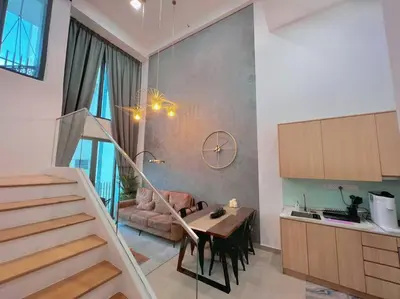 a kitchen and dining room with a table and a staircase at Duplex 4px@Colony, Near Quill CityMall & Monorail in Kuala Lumpur