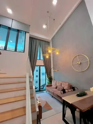 a living room with a couch and a table at Duplex 4px@Colony, Near Quill CityMall & Monorail in Kuala Lumpur