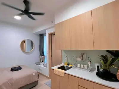 a bedroom with a bed and a sink and a ceiling fan at 3PX Suite @Colony Near Quill City Mall&Monorail in Kuala Lumpur