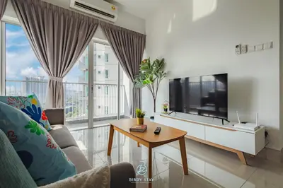 a living room with a tv and a couch and a table at RC Residences @ Sungai Besi Homestay by Birdy Stay in Kuala Lumpur