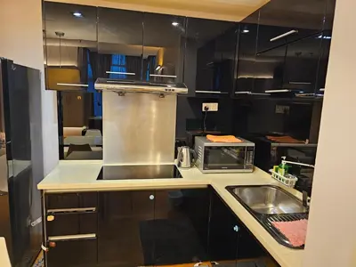 a kitchen with a sink and a microwave at Premier 2BR Suites, Dua Sentral in Kuala Lumpur