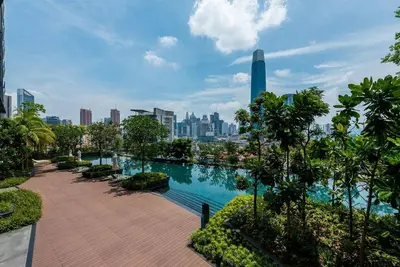 a swimming pool with a city skyline in the background at Continew by Plush Services in Kuala Lumpur