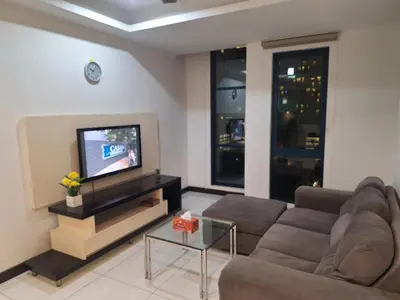 a living room with a couch and a tv at 09-7 Sweet Home-Casa Residency in Kuala Lumpur