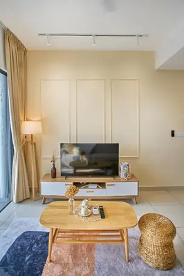 a living room with a tv and a coffee table at Trion Kuala Lumpur by Cobnb in Kuala Lumpur