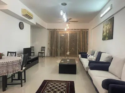 a living room with a couch and a table at Villa Wangsamas By A.Golkar in Kuala Lumpur