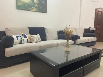 a living room with a couch and a coffee table at Villa Wangsamas By A.Golkar in Kuala Lumpur